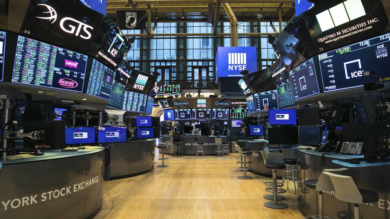 FILE - This photo provided by the New York Stock Exchange shows the unoccupied NYSE trading floor, closed temporarily for the first time in 228 years as a result of coronavirus concerns, Tuesday March 24, 2020. Global stocks and U.S. futures declined Thursday after the U.S. Senate approved a proposed $2.2 trillion virus aid package following a delay over its details and sent the measure to the House of Representatives. (Kearney Ferguson/NYSE via AP, File)